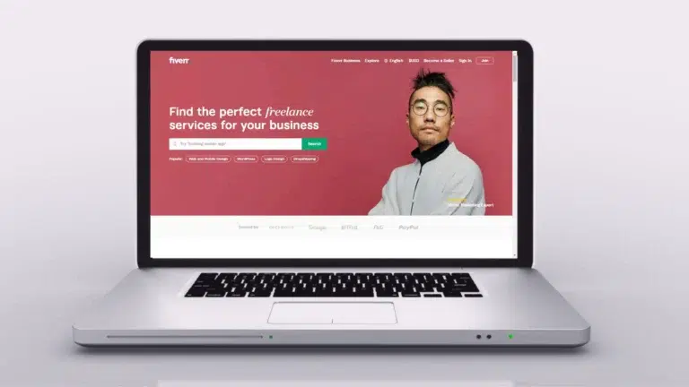 Freelancer doing data entry work on Fiverr using laptop